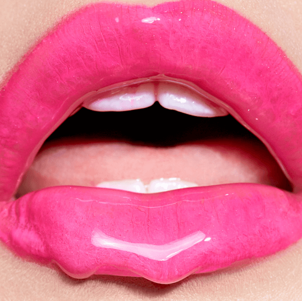 Close up of pink lips with dripping lip gloss