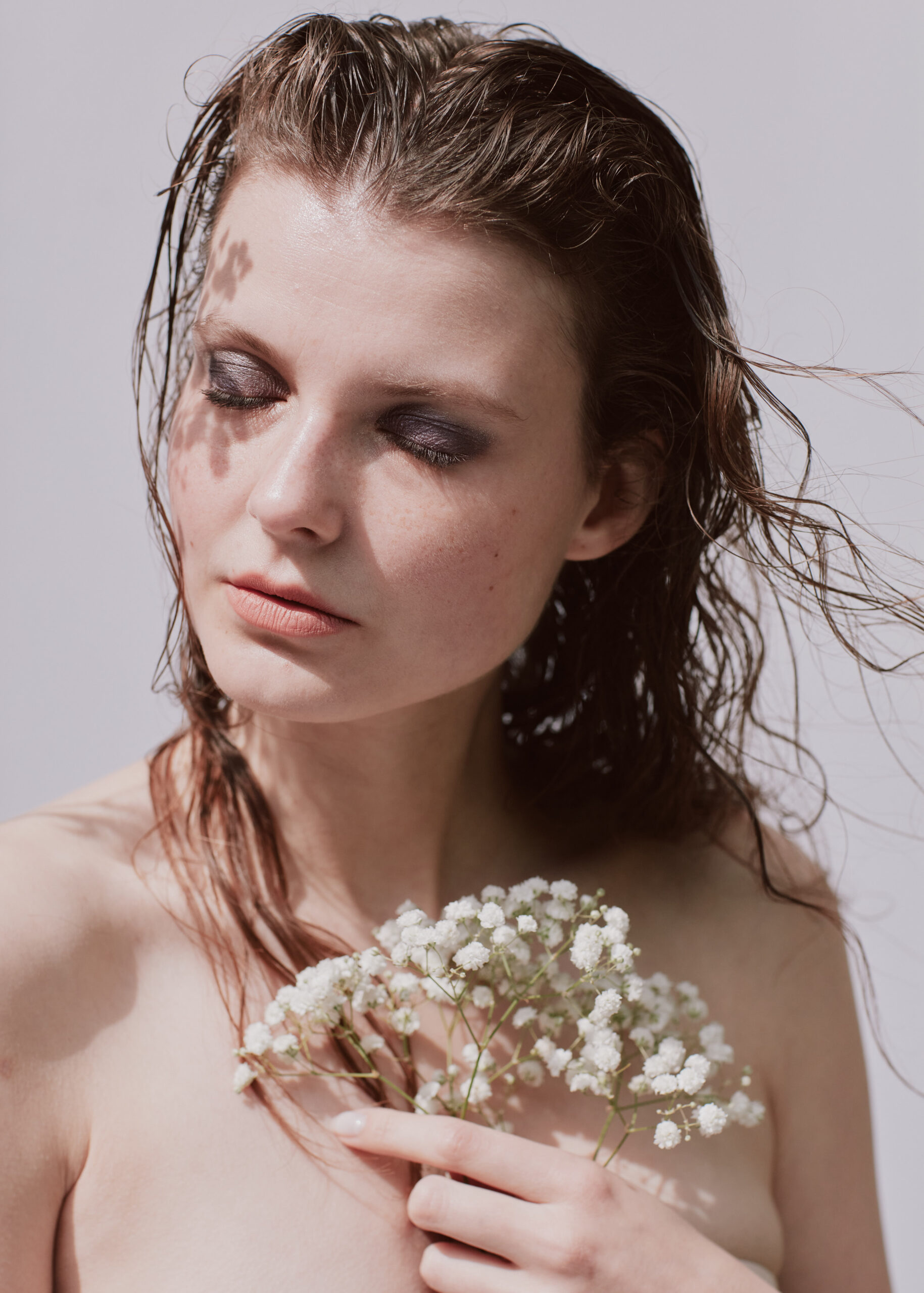 Beauty photography of model holding flowers